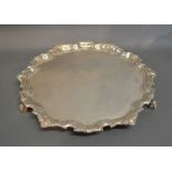 A Britannia Standard Silver Large Salver of Shaped Outline with three scroll feet, London 1935,