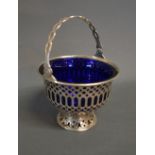 An Edwardian Silver Sugar Basket of Pierced Form with Blue Glass Liner,