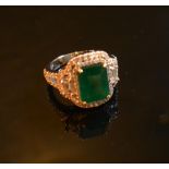 An 18ct. White Gold Emerald and Diamond Ring, approximately 3.10 / 0.77 ct.