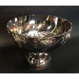 A Silver Plated Large Punch Bowl decorated in relief with grape vine,