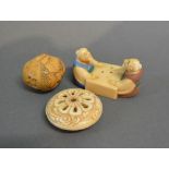 A Late 19th Early 20th Century Japanese Netsuke in the form of two figures playing a game,