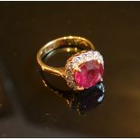 An 18ct. Yellow Gold Treated Ruby and Diamond Cluster Ring, 3.78 / 0.41 ct.