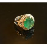 An 18ct. White Gold Emerald and Diamond Ring, approximately 3.37 / 0.43 ct.