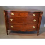 An Early 20th Century Mahogany Bow Fronted Commode with three drawers and oval brass handles