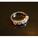 An 18ct. White Gold Five Stone Round Bri