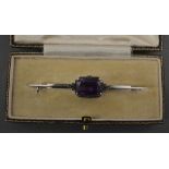 A 9ct. White Gold Amethyst Set Bar Brooc