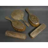 An Edwardian Birmingham Silver Five Piece Dressing Table Set comprising four brushes and a hand