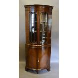 A Reproduction Mahogany Bow Fronted Standing Corner Cabinet,