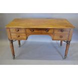 A William IV Mahogany Writing Table with an arrangement of five drawers with knob handles raised