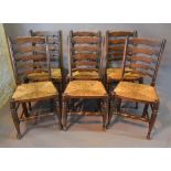A Set of Six Country Ladder Back Dining Chairs with Rush Seats and Turned Legs with Pad Feet