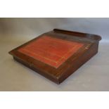 A 19th Century Mahogany Clerk's Desk with red tooled leather writing slope