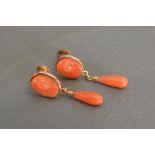 A Pair of Gold and Coral Set Ear Clips of Cameo Form