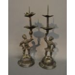 A Pair of 19th Century Chinese Bronze Candlesticks of Figural Form,