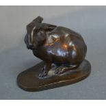 A 19th Century Patinated Bronze Model in the form of a Hare, signed with monogram,