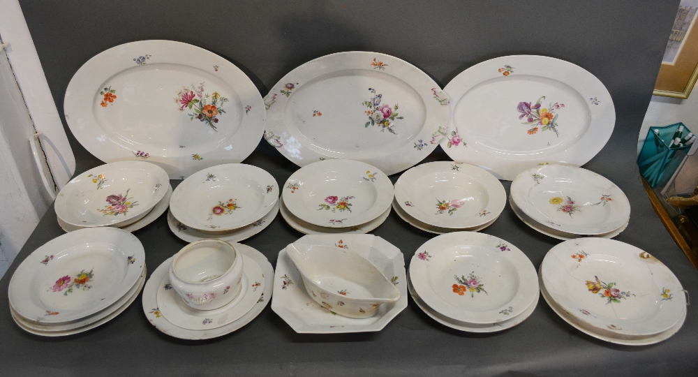 A Berlin Porcelain Dinner Service comprising plates, bowls and three meat platters,