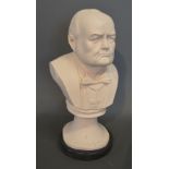 A Reconstituted Marble Bust in the form of Winston Churchill upon ebonised circular base,