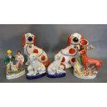 A Pair of Staffordshire Models of Spaniels together with a similar smaller pair of Staffordshire