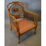 An Edwardian Satinwood Sheraton Revival Bergere Armchair,