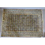 A North West Persian Woollen Rug with an all over design upon a blue ground within multiple borders,