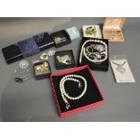 A Collection of Costume Jewellery, within boxes and loose to include bangles, earrings,