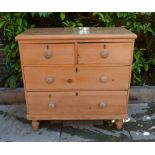 A Victorian Pine Small Chest of Two Short and Two Long Drawers with Knob Handles raised upon low