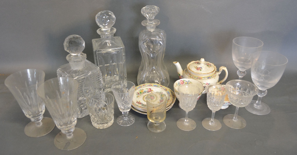 A Collection of Three Cut Glass Decanters with Stoppers,