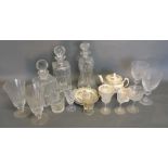 A Collection of Three Cut Glass Decanters with Stoppers,