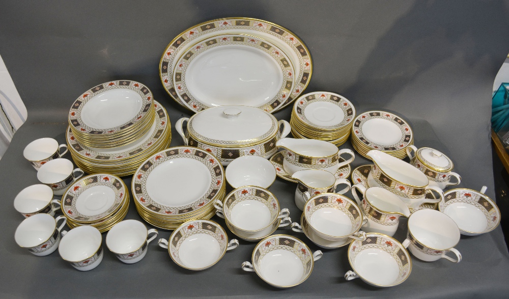 A Royal Crown Derby Derby Border Pattern Dinner and Tea Service decorated in the Imari palette and