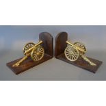 A Pair of Bookends, each mounted with a