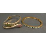 A Bangle in the form of Two Snake Heads,