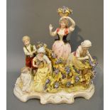 A German Porcelain Group depicting Figures Amongst Foliage upon a shaped base highlighted with gilt,