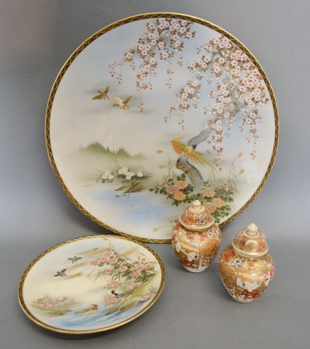 A Japanese Satsuma Large Dish, decorated with an exotic bird amongst foliage,