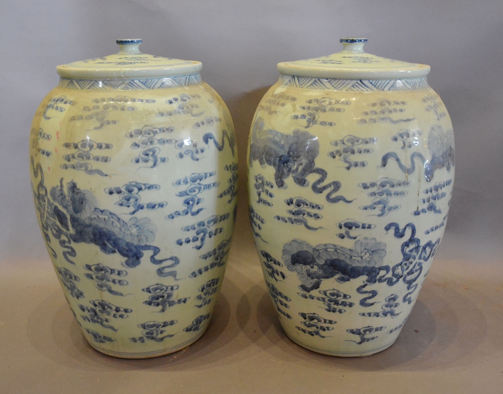 A Pair of Chinese Large Floor Standing Covered Vases, decorated in underglaze blue,