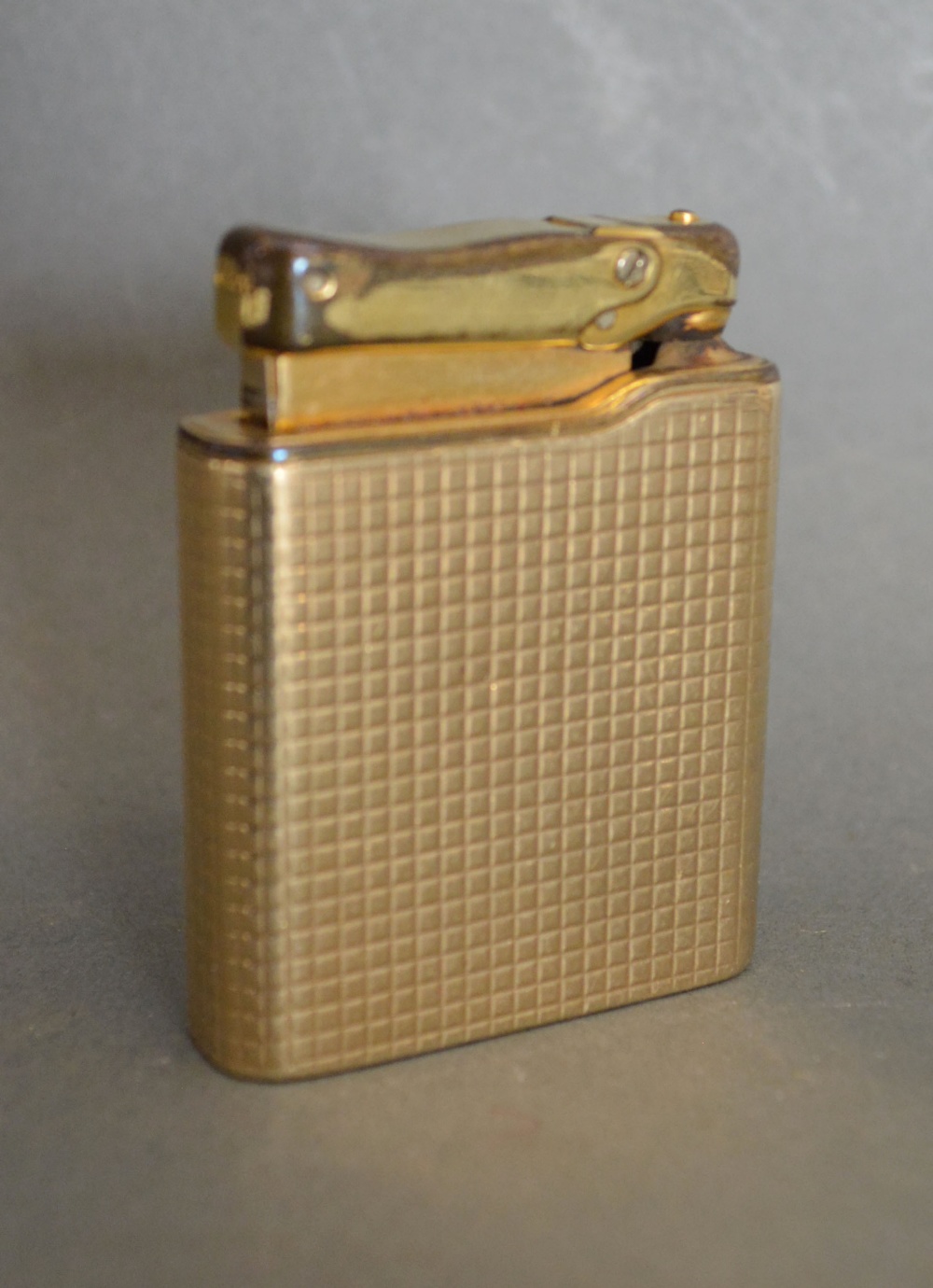 A 9ct Gold Cased Lighter by Colibri Monogas