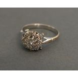 An 18ct White Gold Diamond Cluster Ring with a central diamond surrounded by diamonds within a