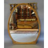 An Art Nouveau Mahogany Over Mantle Mirror with a carved pierced frieze,