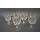 A Set of Ten Late 19th Century Cut Glass Wine Glasses with circular pedestal bases