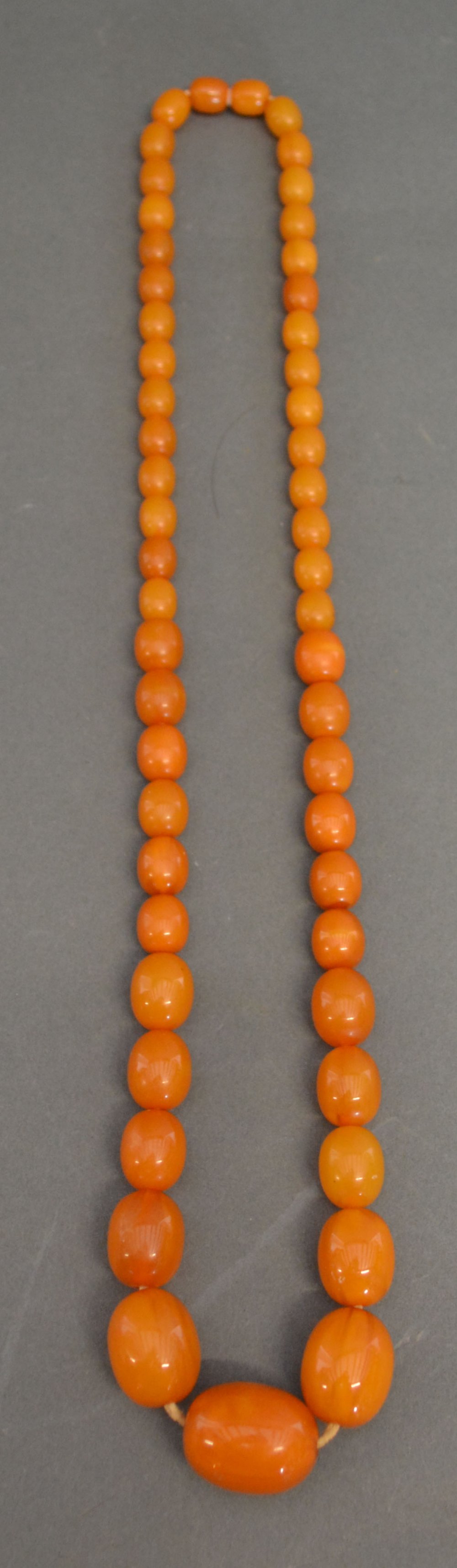 An Early 20th Century Butterscotch Graduated Amber Bead Necklace, 45.