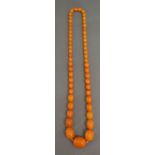 An Early 20th Century Butterscotch Graduated Amber Bead Necklace, 45.