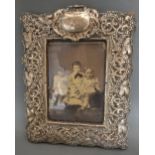 A Rectangular Silver Photograph Frame of Embossed Shaped Outline,
