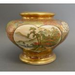 A Japanese Satsuma Earthenware Squat Vase decorated with reserves and highlighted with gilt,