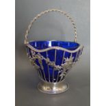A George III Silver Basket of Pierced Foliate Form with Birds Amongst Foliate and Rope Twist Handle