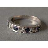 An 18ct White Gold Diamond and Sapphire Set Half Hoop Ring,