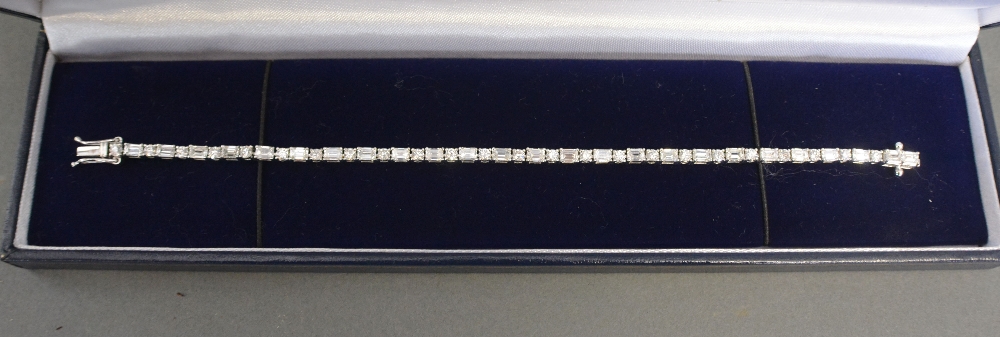 An 18ct White Gold Baguette and Round Brilliant Cut Diamond Bracelet, approximately 5.