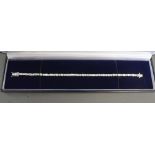 An 18ct White Gold Baguette and Round Brilliant Cut Diamond Bracelet, approximately 5.