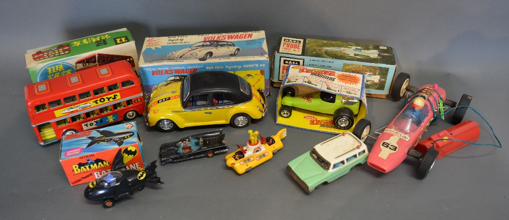 A Corgi Toys 'The Beatles' Yellow Submarine together with a Volkswagen battery operated Beetle and