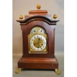 A 19th Century Mahogany Large Bracket Clock with gilt metal pineapple finials and brass paw feet,