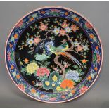 An Early 20th Century Chinese Large Charger decorated in coloured enamels with exotic amongst