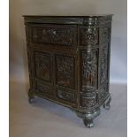 A Chinese Carved Hardwood Side Cabinet with a hinged top enclosing a fitted interior above two