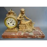 A 19th Century French Gilded Mantle Clock with Figural Surmount,